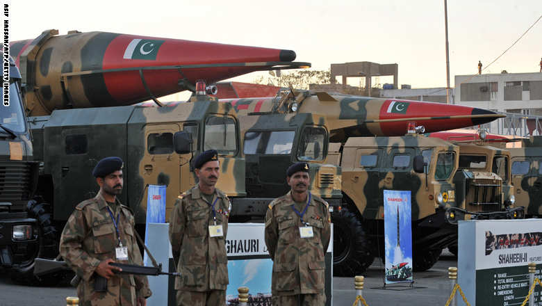 Pakistani Army soldiers guard nuclear-capable missiles at the International Defence Exhibition in Karachi on November 25, 2008. Pakistani authorities deployed nearly 10,000 police and paramilitary troops in Karachi at the start of this week's international defence exhibition. More than 250 companies from nearly 60 countries, including the United States, France, Germany, China and Turkey, are participating in the biennial show of military hardware organised by Pakistan's defence production ministry. AFP PHOTO/Asif HASSAN (Photo credit should read ASIF HASSAN/AFP/Getty Images)