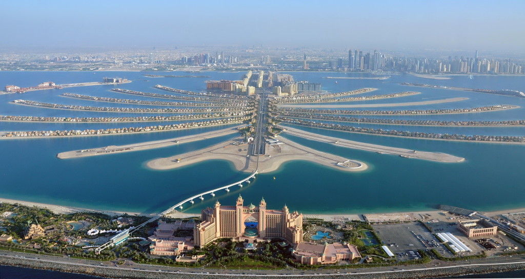 An aerial view of Atlantis hotel is seen with The Palm Jumeirah in Dubai in this December 21, 2009 file photo. The revolts that began in Tunisia at the end of 2010 and spread across the Middle East and North Africa had a devastating impact on tourism, but not everyone in the region lost out. While recovery from the turmoil has been at best tentative, at worst non existent, places where the Arab Spring has not reached have been unexpected beneficiaries.     REUTERS/Matthias Seifert/Files (UNITED ARAB EMIRATES - Tags: CITYSCAPE BUSINESS TRAVEL)